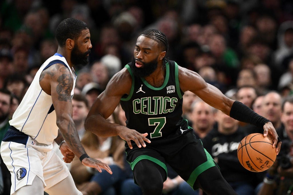 Boston Celtics guard Jaylen Brown drives with the basketball as we look at our NBA Finals MVP odds and predictions.