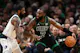 Jaylen Brown of the Boston Celtics drives to the basket against Kyrie Irving of the Dallas Mavericks as we look at the best 2024 NBA Finals odds