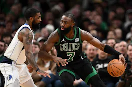 Jaylen Brown of the Boston Celtics drives to the basket against Kyrie Irving of the Dallas Mavericks as we look at the best 2024 NBA Finals odds