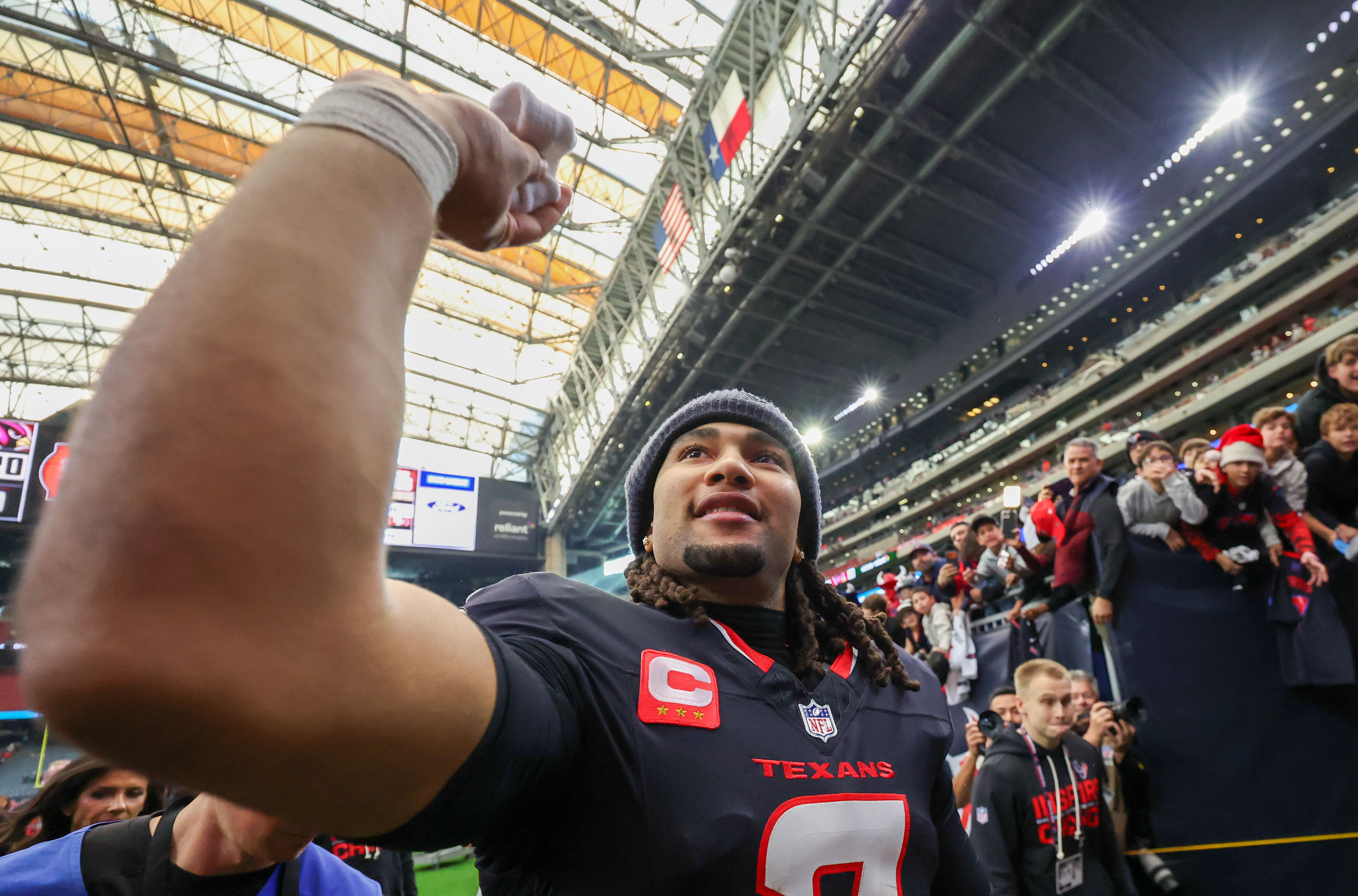 Houston Texans quarterback C.J. Stroud throws his wristband to a fan as we look at the top survivor plays for NFL Week 16.