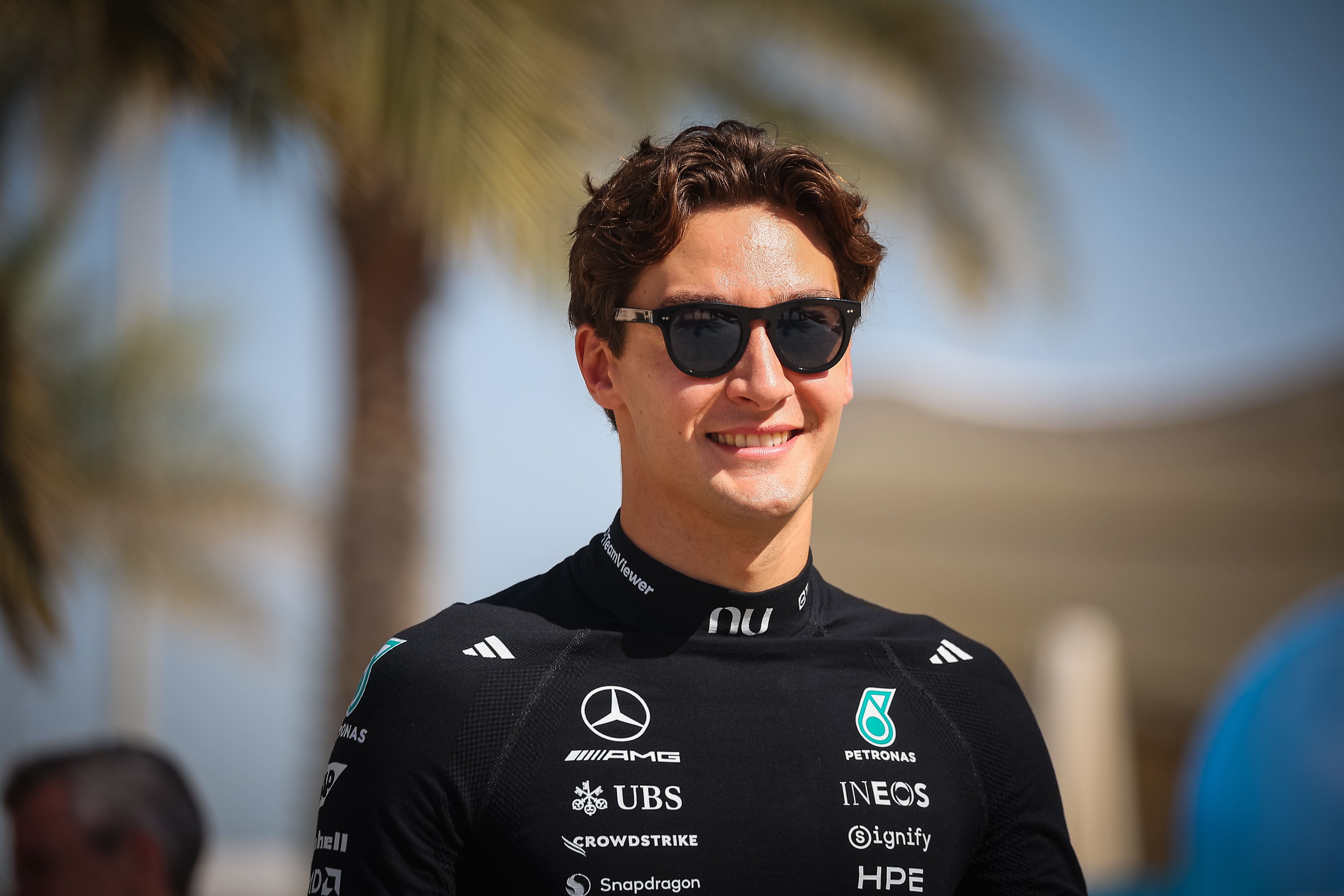 George Russell walks through the paddock as we look the Australian Grand Prix predictions and odds.