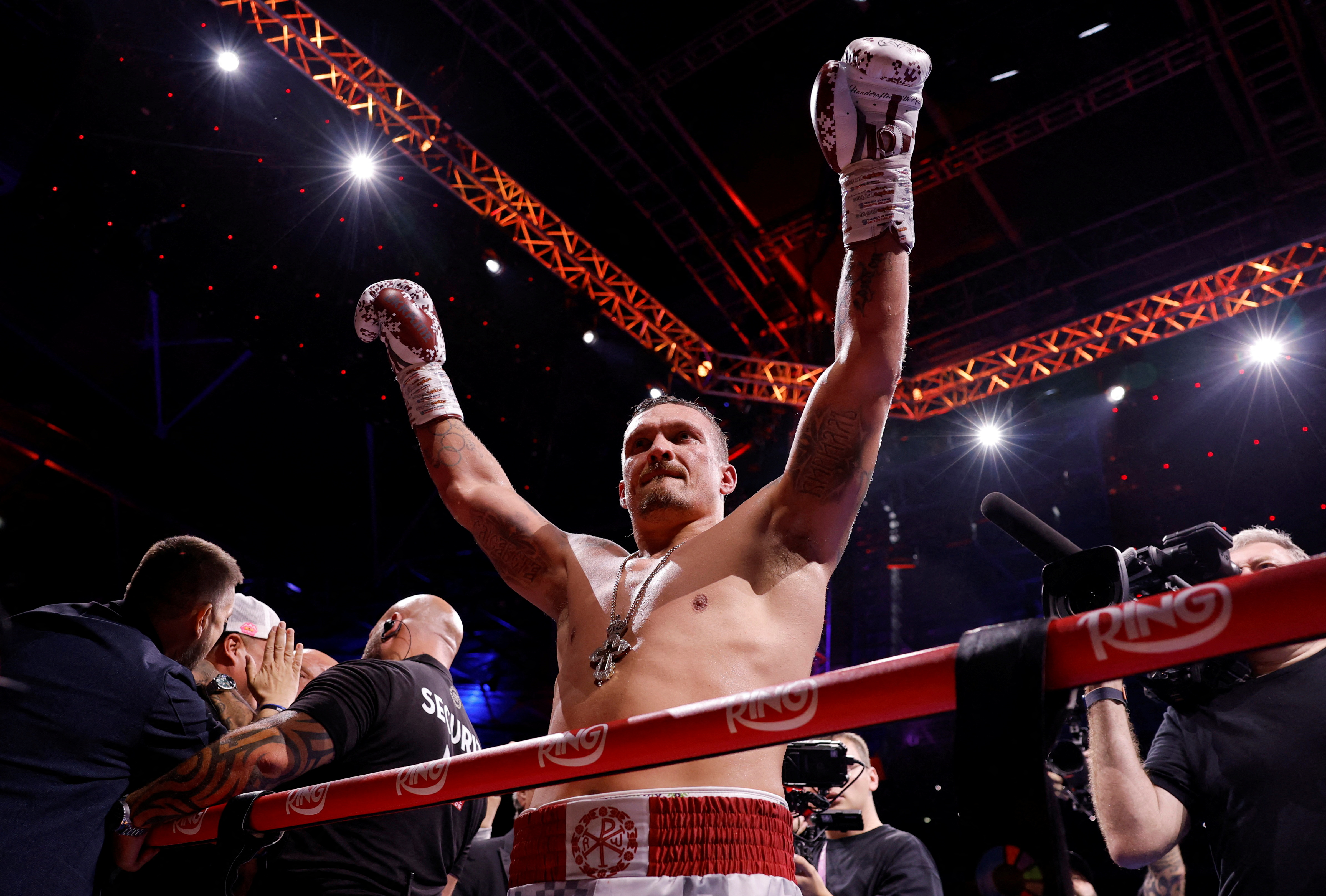 Oleksandr Usyk celebrates winning a fight as we make our best Usyk vs. Verhoeven prediction.