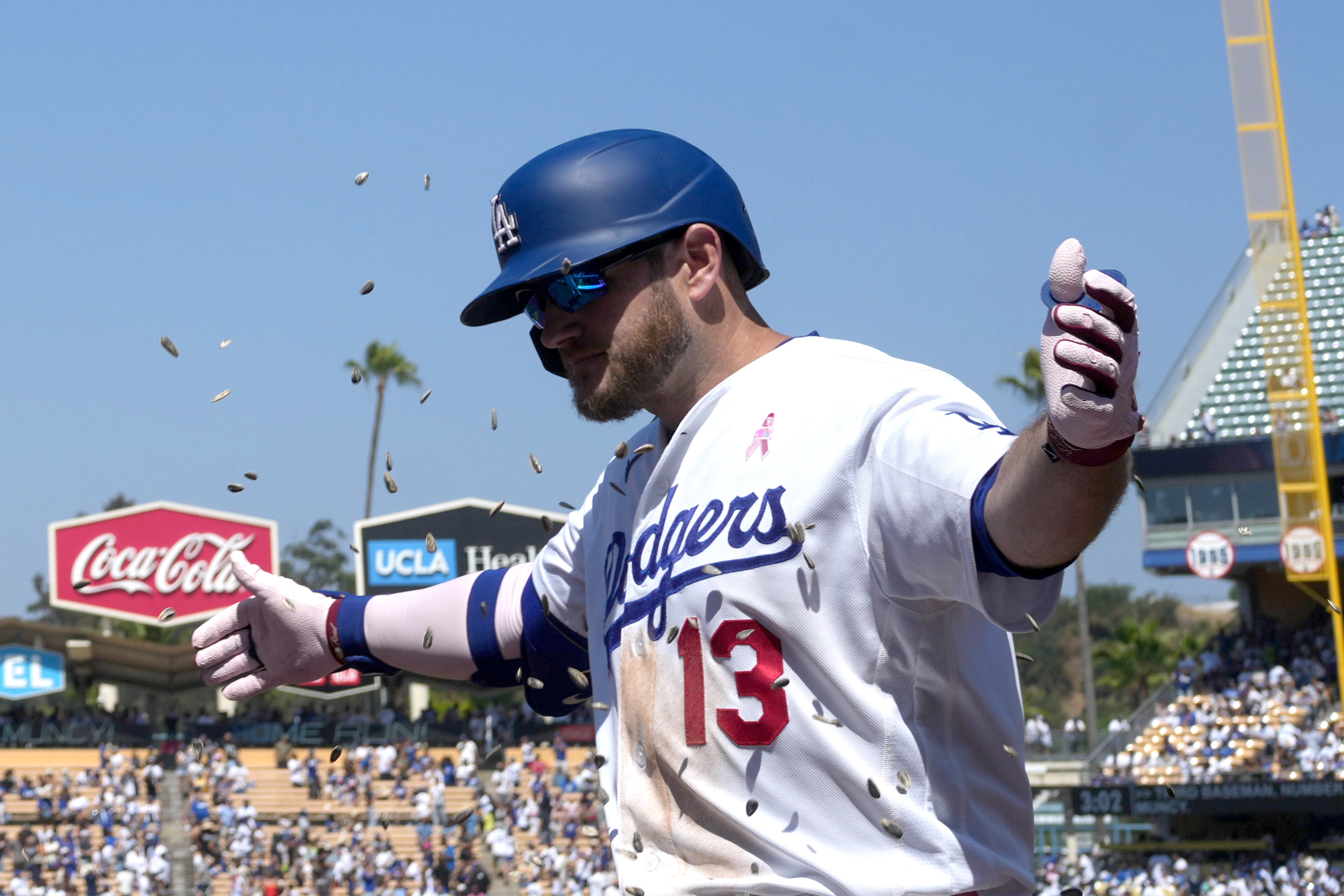 Los Angeles Dodgers third baseman Max Muncy (13) is showered with sunflower seeds as we break down our home run predictions today.