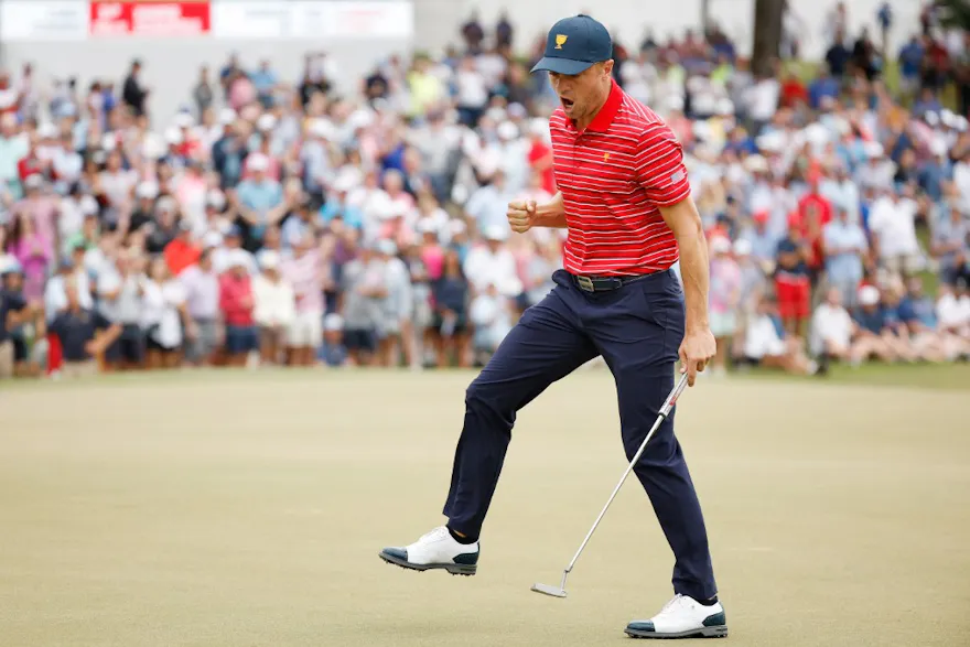 Justin Thomas of the United States Team reacts after making his putt on the 15th green during Sunday singles matches on day four of the 2022 Presidents Cup at Quail Hollow Country Club on September 25, 2022 in Charlotte, North Carolina.