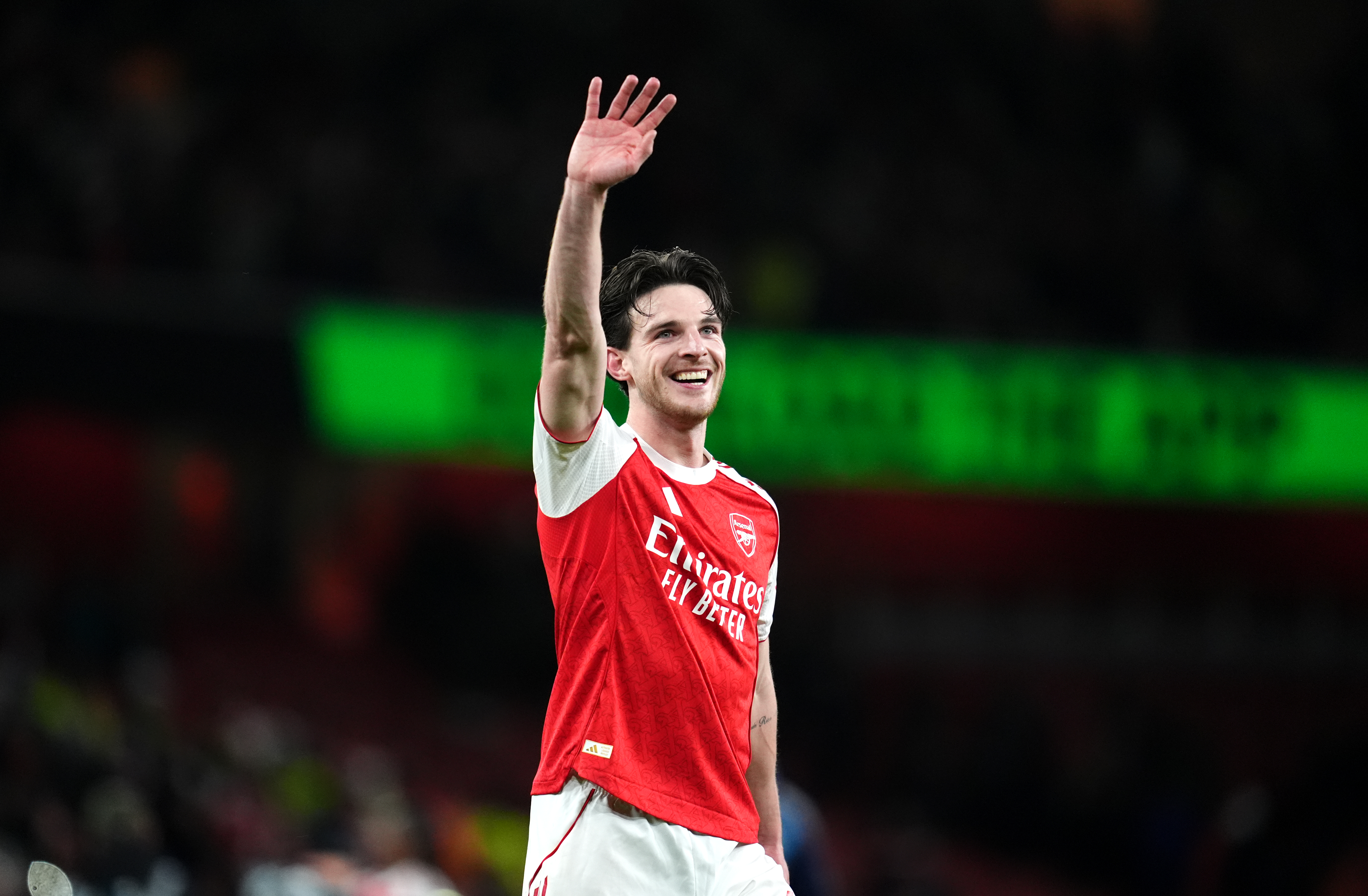 Arsenal's Declan Rice salutes the fans as we make our best Arsenal vs. Brentford prediction. 