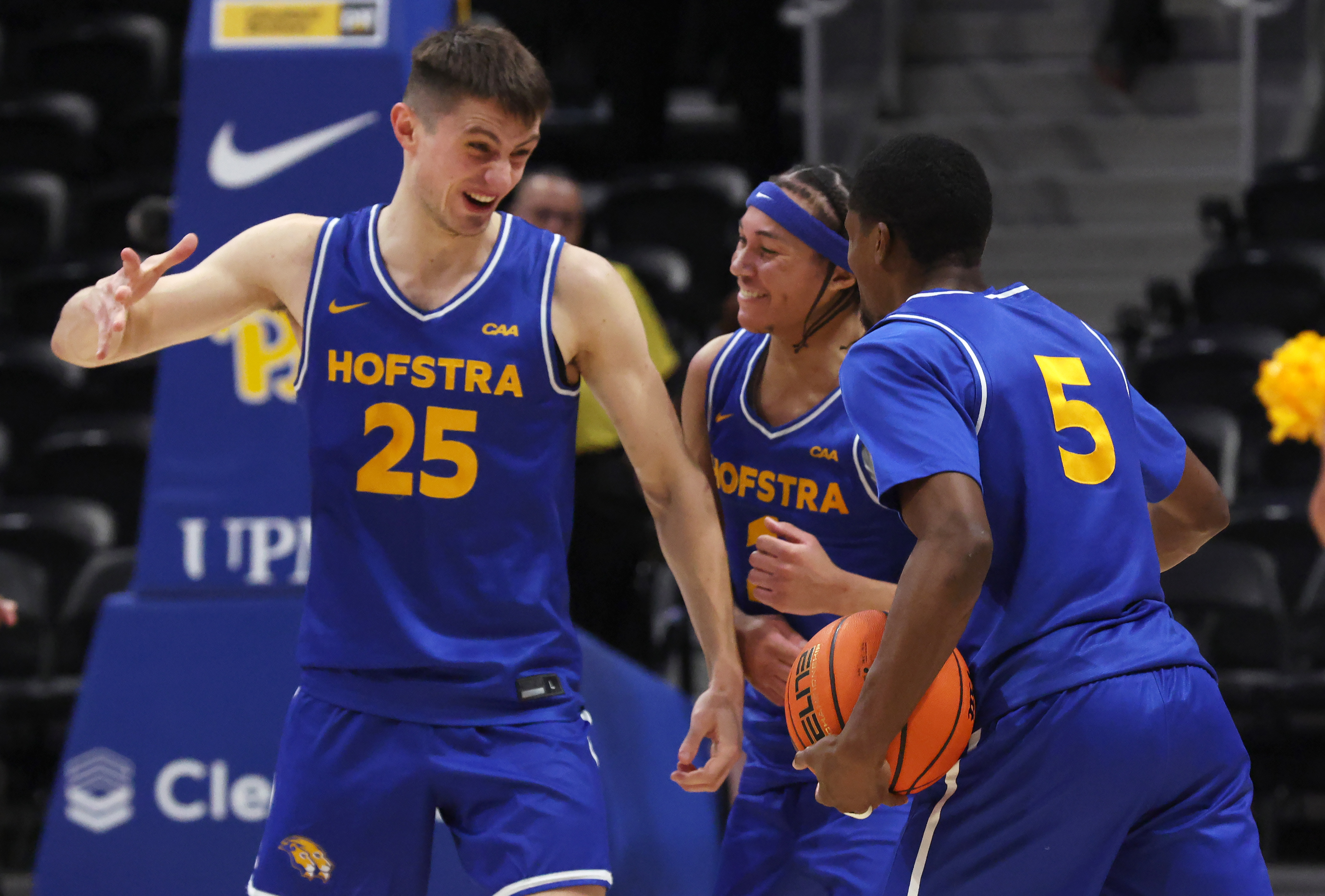 Hofstra Pride guard German Plotnikov (25), guard Preston Edmead (middle) and guard Cruz Davis (5), featured in our Hofstra vs. Alabama prediction, celebrate after defeating the Pittsburgh Panthers.
