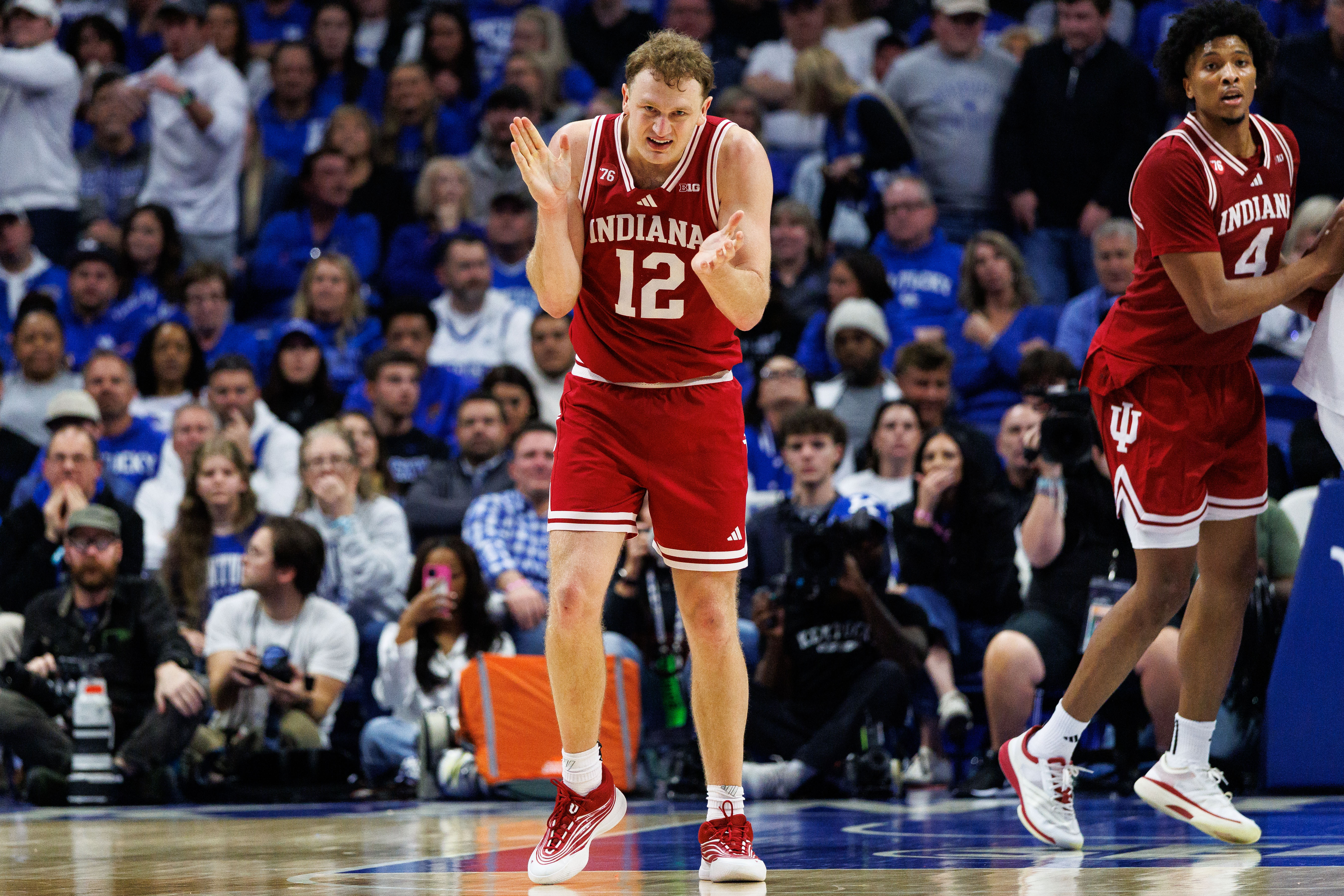 Indiana forward Tucker Devries (12) celebrates a basket as we offer our college basketball best bets today.