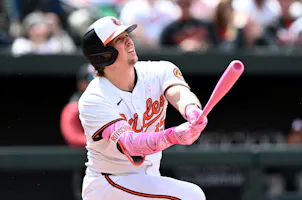 Adley Rutschman of the Baltimore Orioles hits a home run as we look at the Maryland sports betting financials for April 2024.