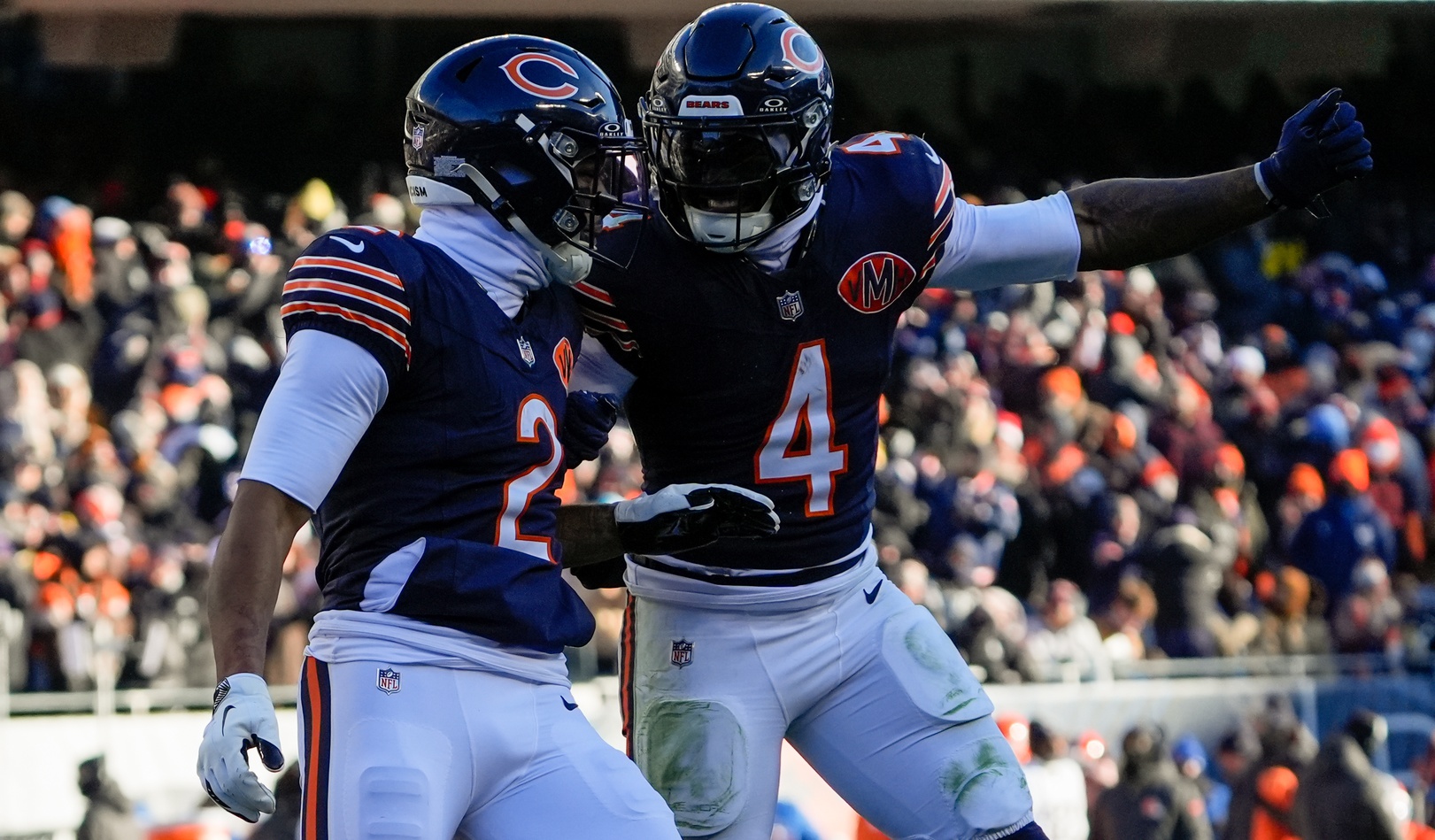 Chicago Bears wide receiver DJ Moore and Chicago Bears running back D'Andre Swift celebrate after a touchdown as we look at the Packers vs. Bears weather report tonight