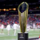 The National Championship Trophy is seen on the field prior to the 2022 CFP National Championship Game between the Alabama Crimson Tide and Georgia Bulldogs at Lucas Oil Stadium on Jan. 10. 