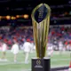 The National Championship Trophy is seen on the field prior to the 2022 CFP National Championship Game between the Alabama Crimson Tide and Georgia Bulldogs at Lucas Oil Stadium on Jan. 10.