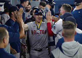 Boston Red Sox left fielder Tyler O'Neill gets congratulated after his solo home run against the Toronto Blue Jays during the eighth inning at Rogers Centre as we look at our Blue Jays vs. Red Sox player props.