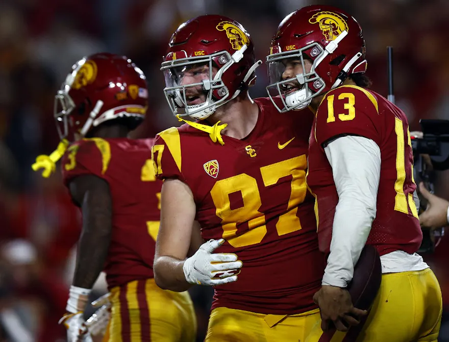 Caleb Williams #13 and Lake McRee #87 of the USC Trojans celebrate a touchdown against the Notre Dame Fighting Irish in the first half at United Airlines Field at the Los Angeles Memorial Coliseum on Nov. 26.