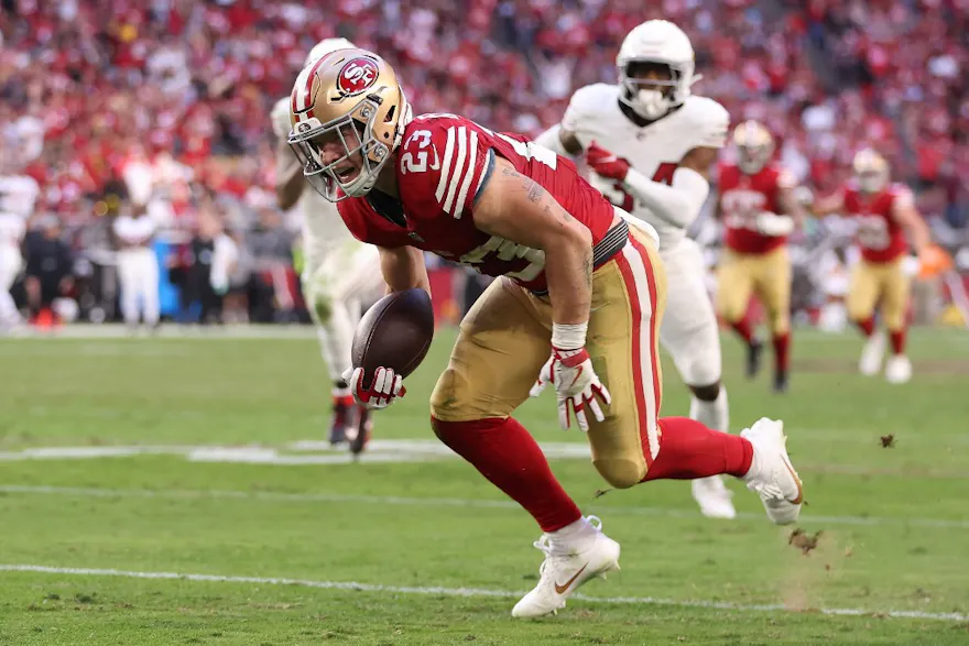 Christian McCaffrey #23 of the San Francisco 49ers runs as we look at our best Lions vs. 49ers NFC Championship predictions