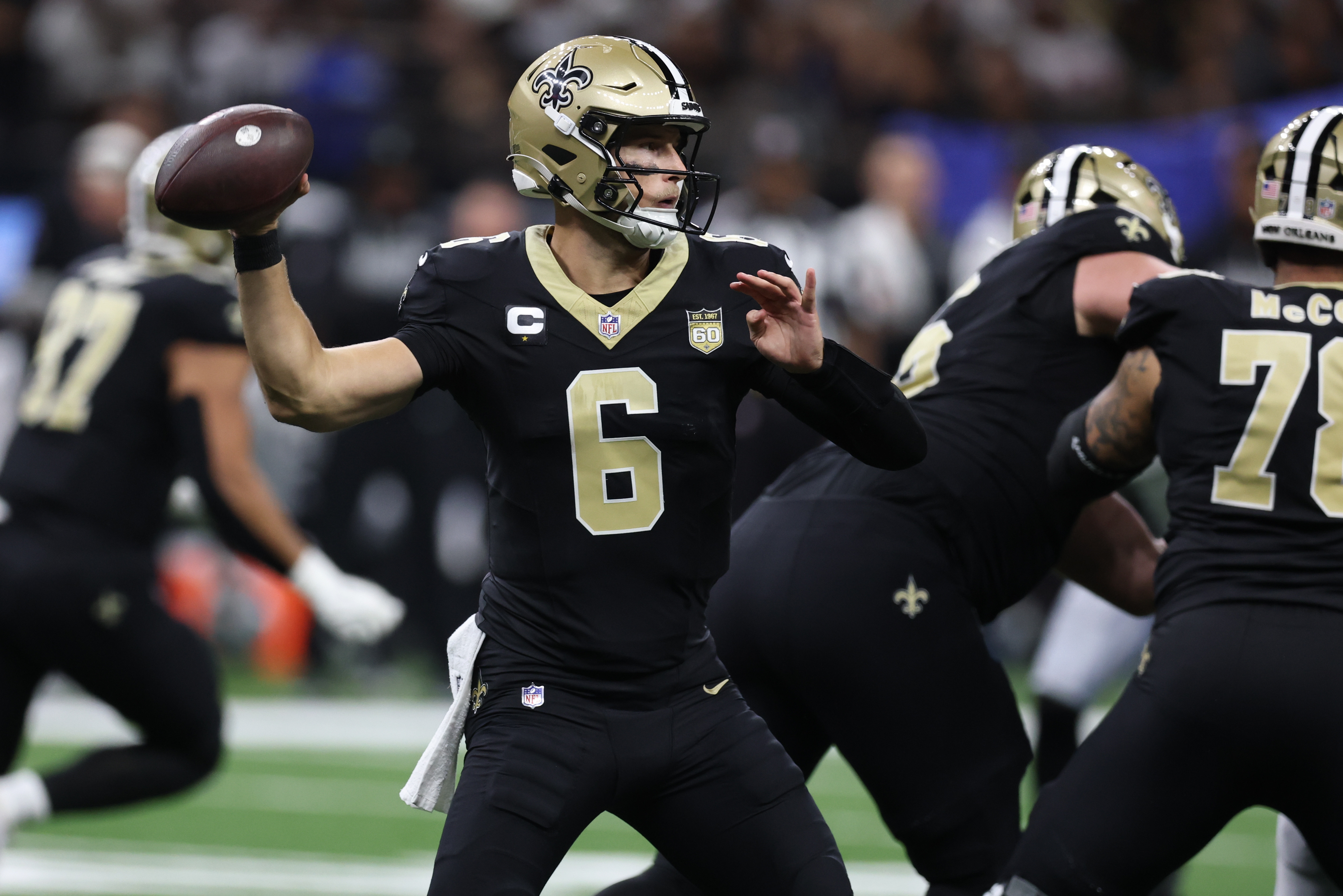 New Orleans Saints quarterback Tyler Shough throws as we make our best Falcons vs. Saints expert picks