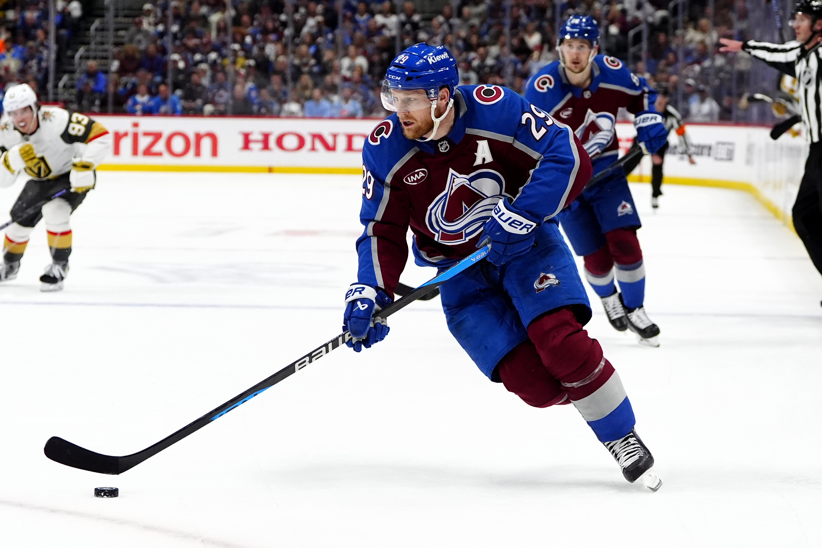 Colorado Avalanche center Nathan MacKinnon (29) skates with the puck as we make our best NHL predictions for Oct. 14.