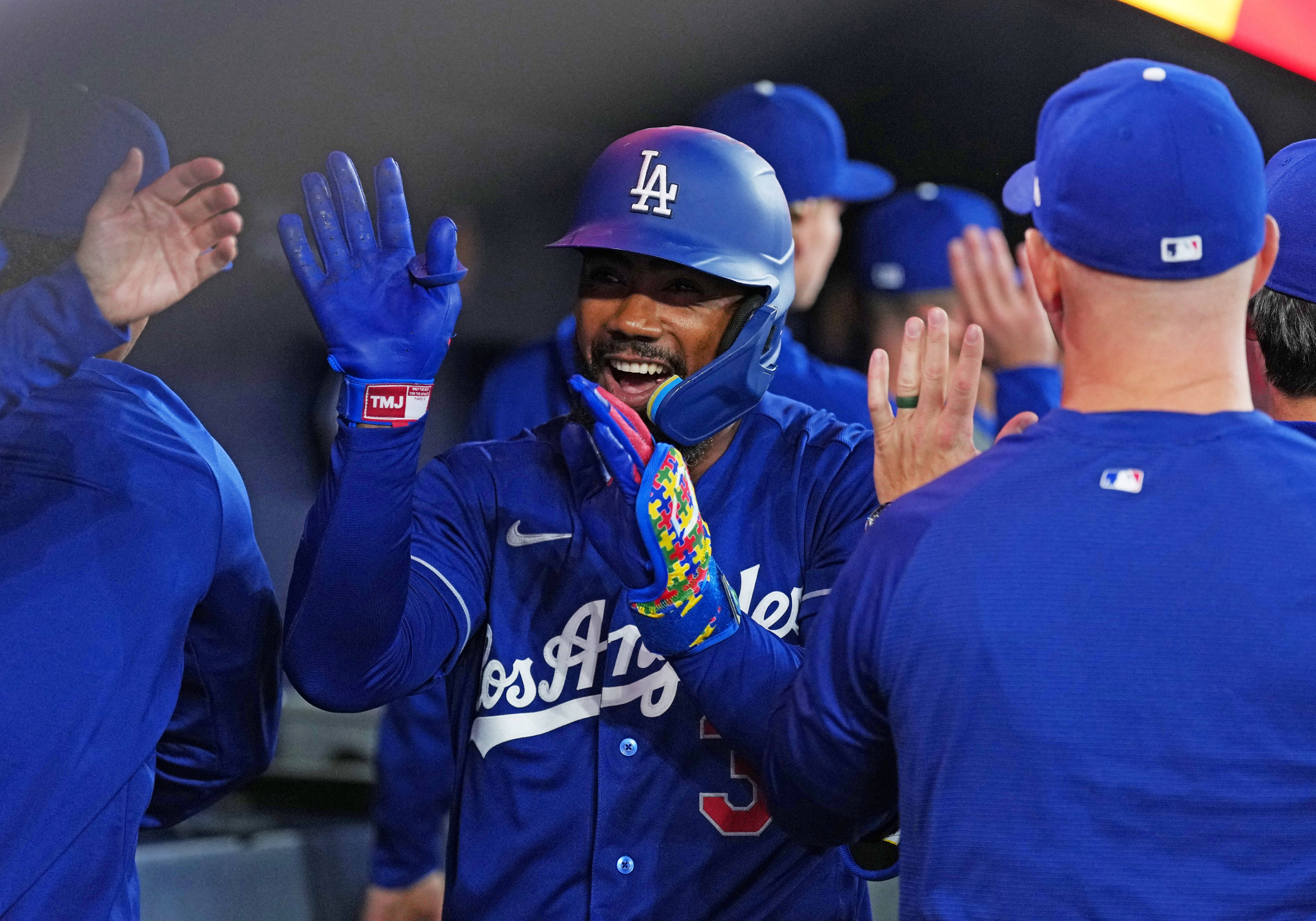  Los Angeles Dodgers left fielder Teoscar Hernandez celebrates in the dugout, and he's key as we look at our home run predictions today.