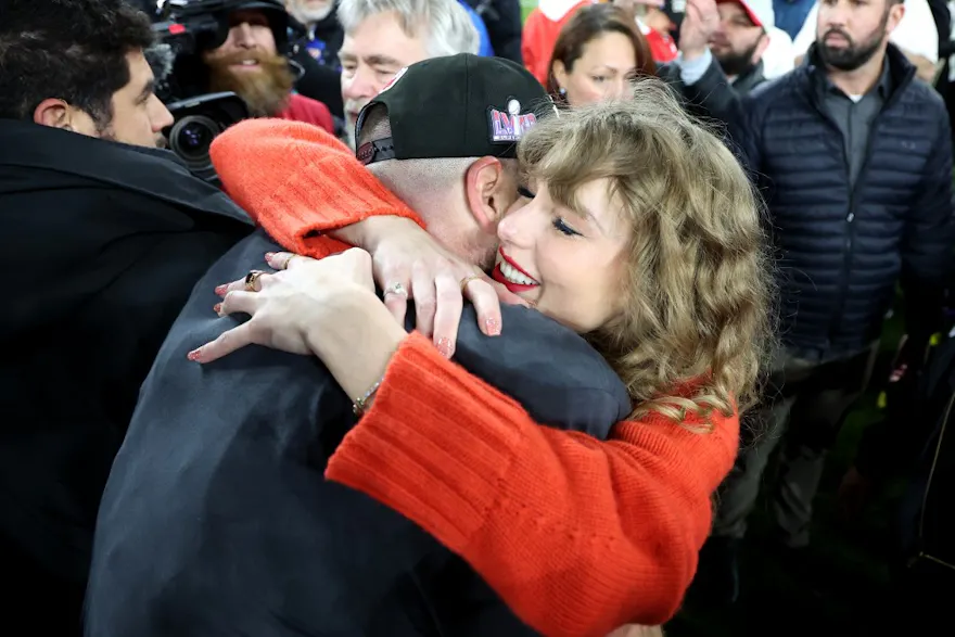 Travis Kelce #87 of the Kansas City Chiefs celebrates with Taylor Swift as we look at Super Bowl prop bets