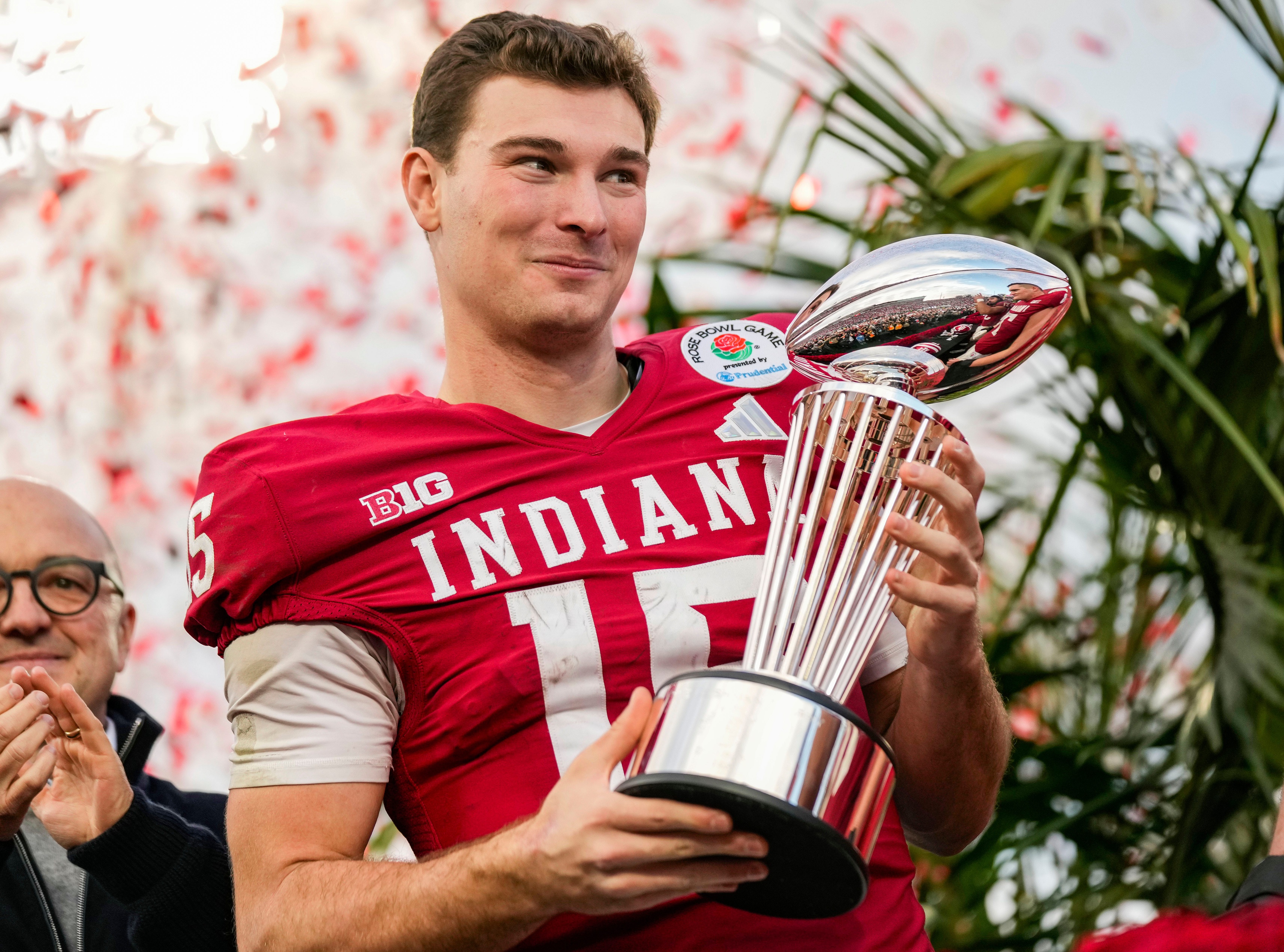 Indiana Hoosiers quarterback Fernando Mendoza (15), who leads the 2026 NFL Draft odds to be the No. 1 pick, holds the Rose Bowl trophy.