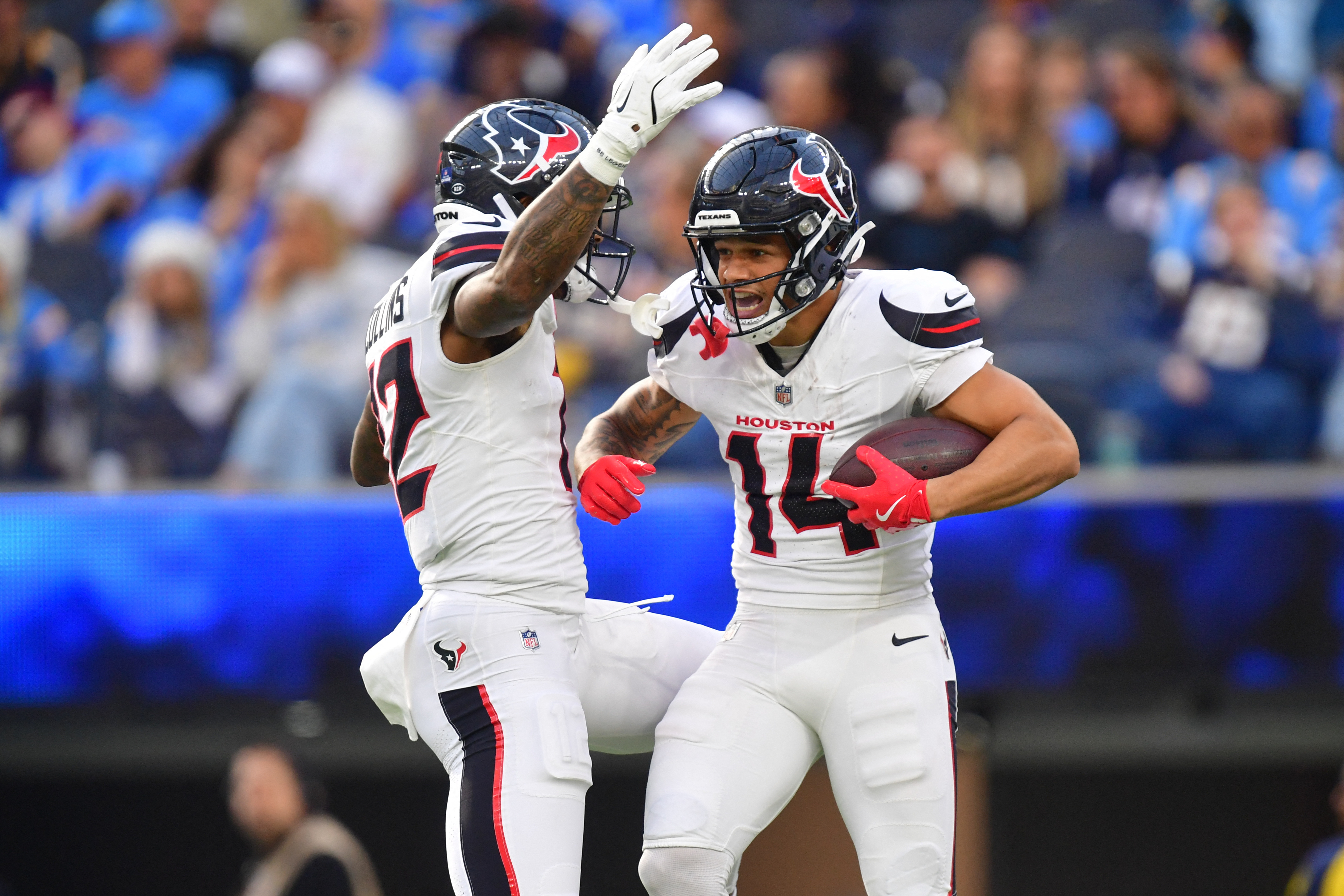 Houston Texans wide receiver Jaylin Noel (14) reacts with wide receiver Nico Collins (12) after catching a touchdown as we look at our NFL playoff predictions