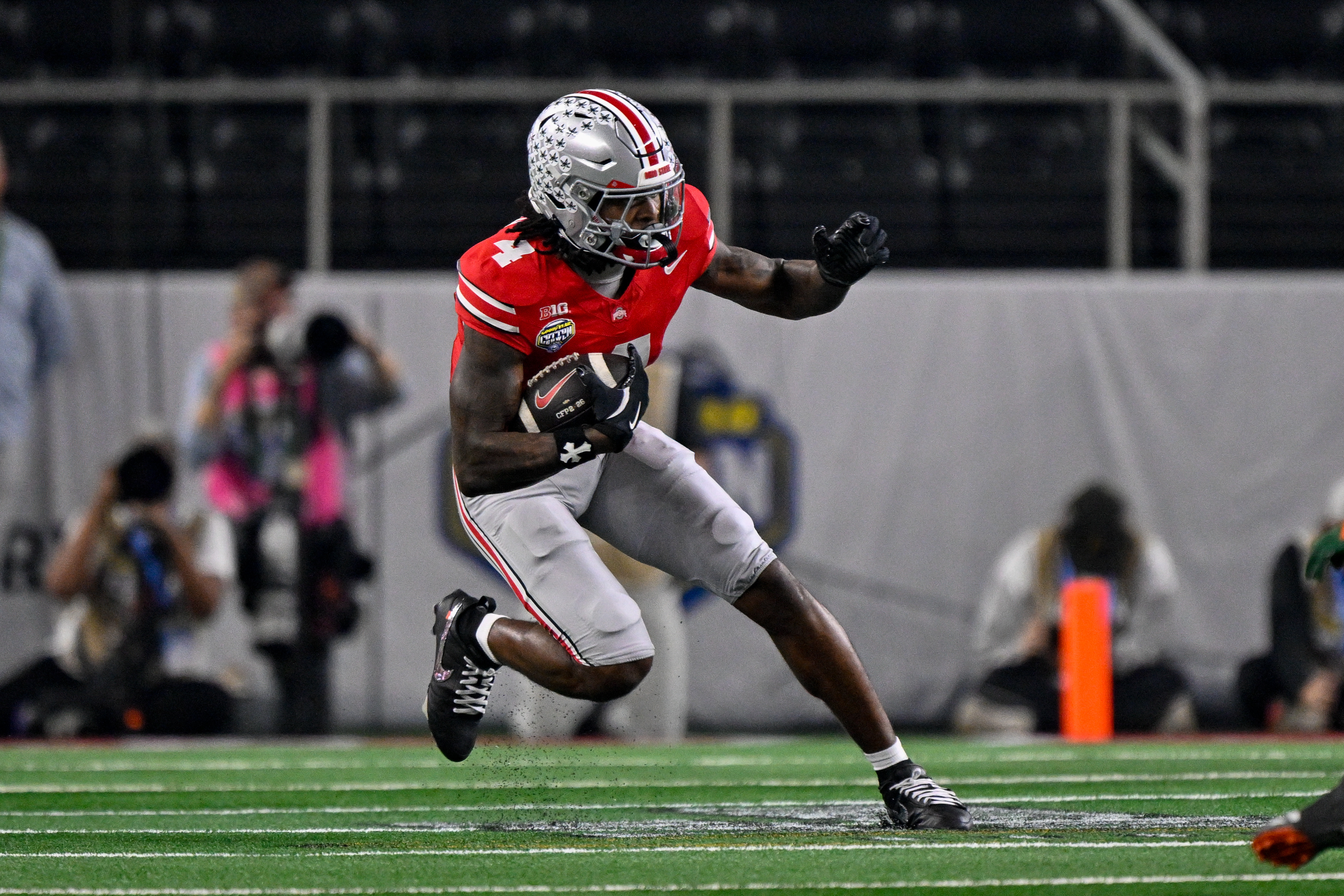 Ohio State Buckeyes wide receiver Jeremiah Smith (4) runs with the ball as we break down our 2026-27 CFP National Championship odds.