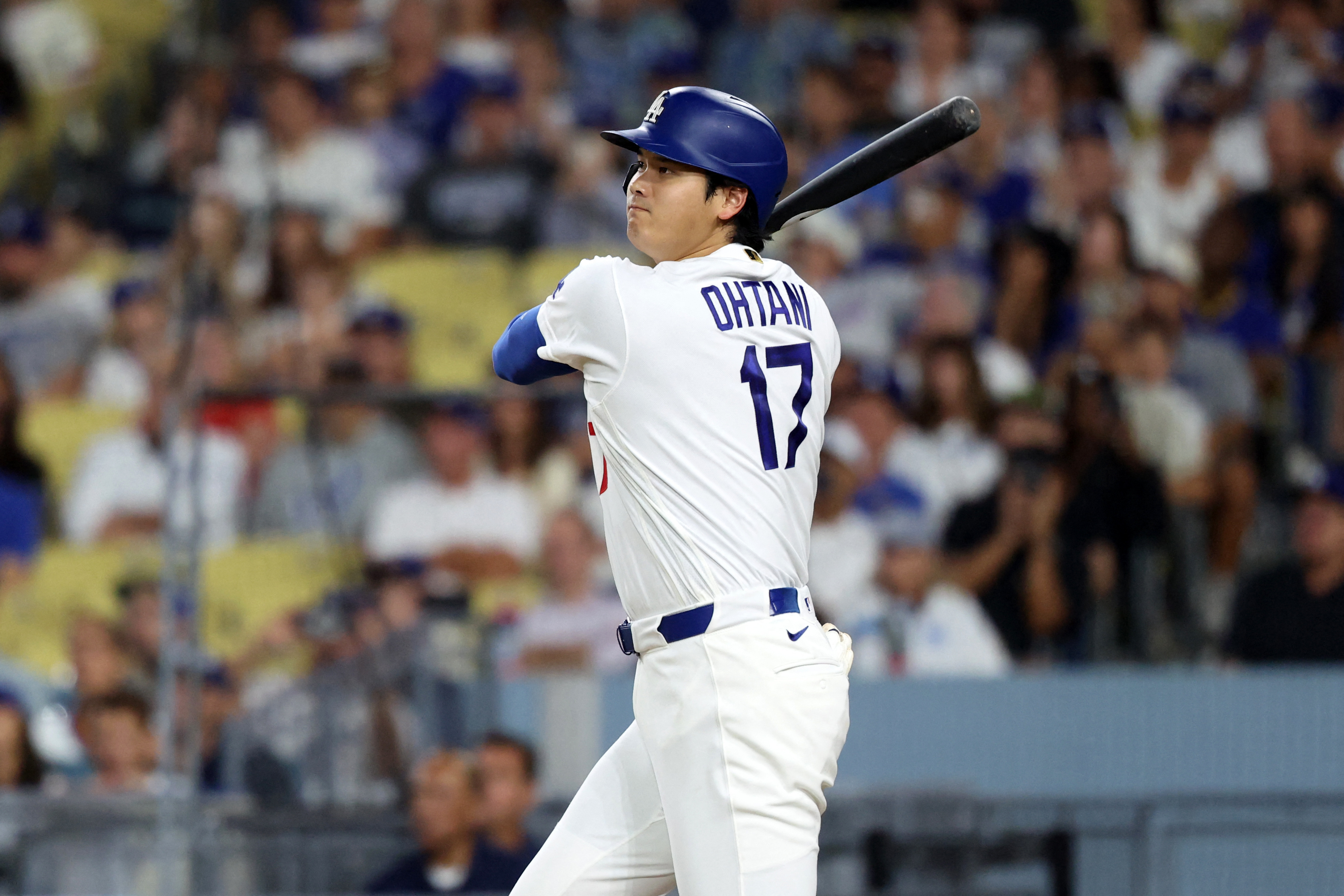 Los Angeles Dodgers two-way player Shohei Ohtani (17) hits an RBI double as he si featured in our home run predictions today.
