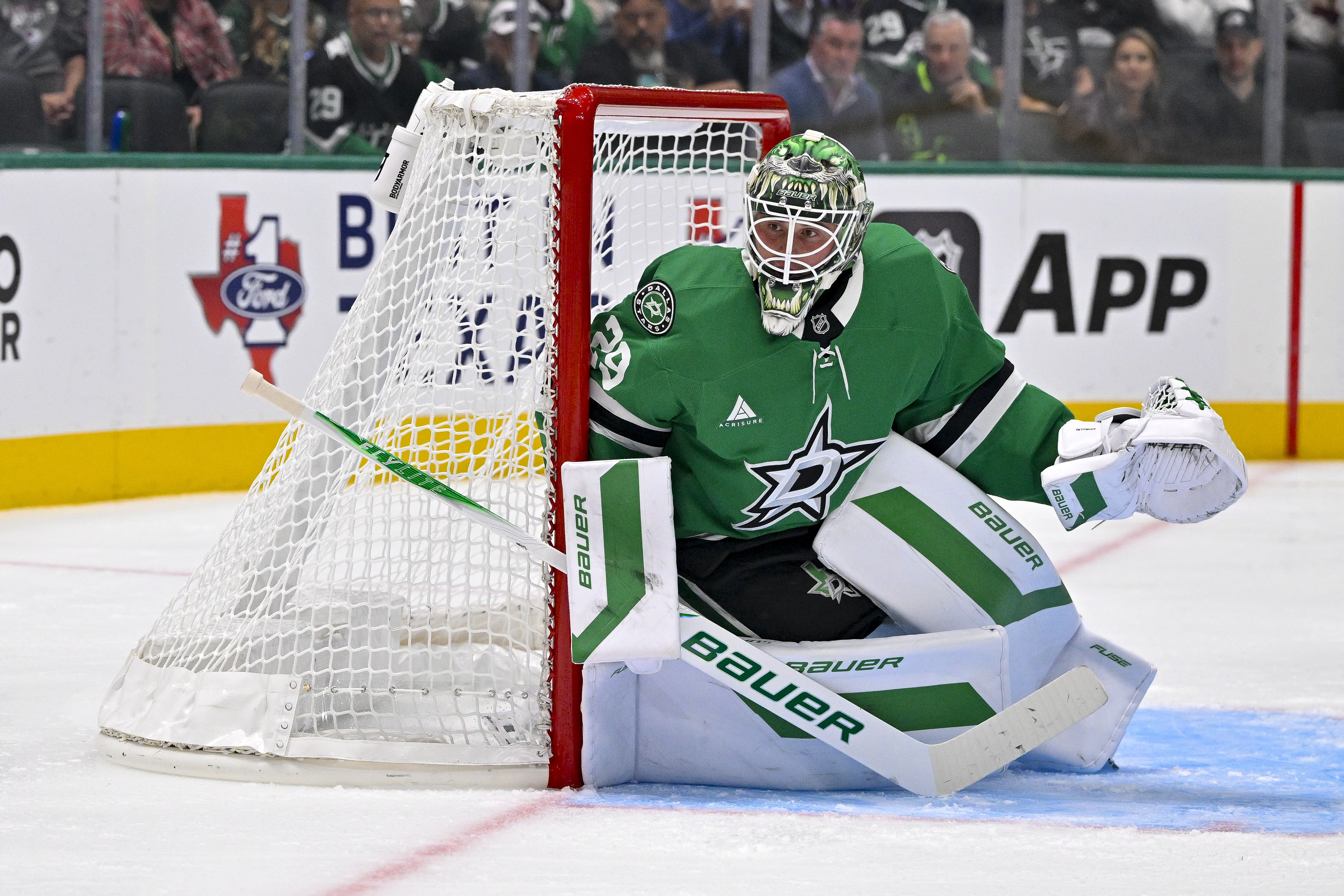 Dallas Stars goaltender Jake Oettinger (29) looks on during the game between the Stars and the Avalanche as we take a closer look at the Vezina Trophy odds.