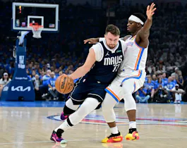 Luka Doncic (77) of the Dallas Mavericks drives to the basket against Luguentz Dort (5) of the Oklahoma City Thunder, as we offer our best Mavericks vs. Thunder player props for Game 2 on Thursday at Paycom Center in Oklahoma City.