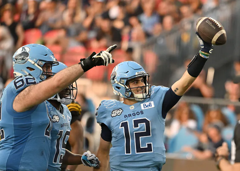 Toronto Argonauts quarterback Chad Kelly celebrates after scoring a touchdown against the Hamilton Tiger-Cats. We're backing Toronto in our Argonauts vs. Tiger-Cats prediction.