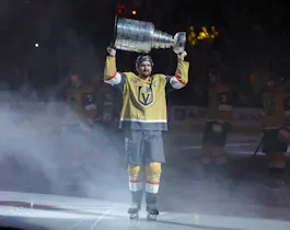 Mark Stone #61 of the Vegas Golden Knights carries the Stanley Cup as we offer the 2024 Stanley Cup playoffs betting guide. 