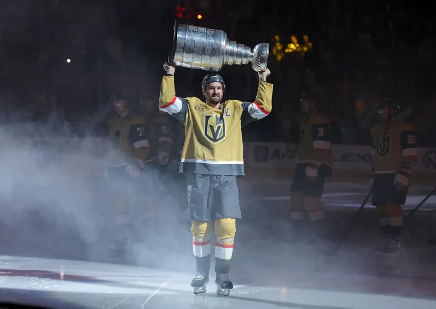 Mark Stone #61 of the Vegas Golden Knights carries the Stanley Cup as we offer the 2024 Stanley Cup playoffs betting guide. 