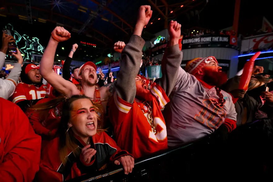 Kansas City Chiefs fans watch celebrate as their team defeats the San Francisco 49ers in Super Bowl LVIII, which saw record sports betting activity.