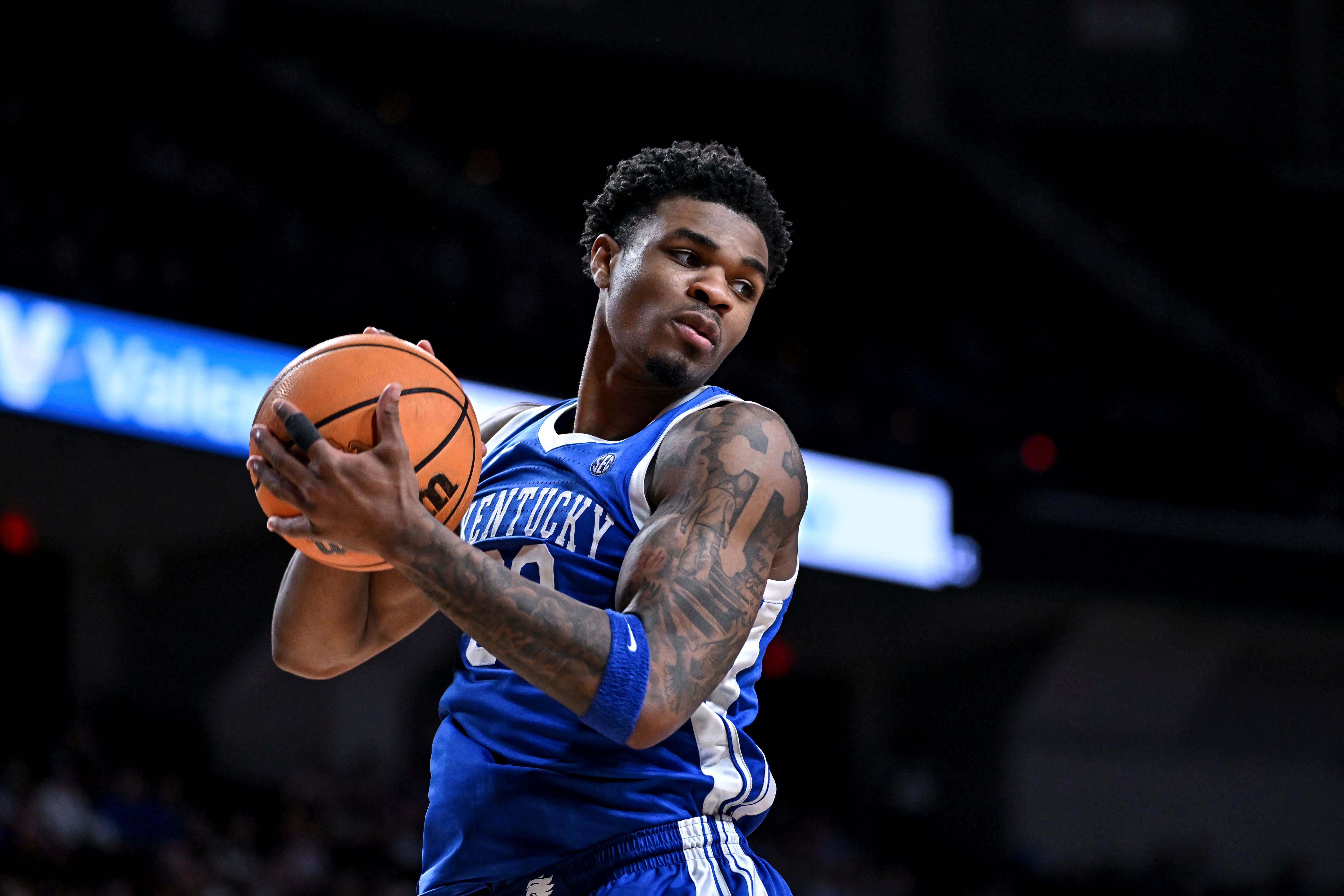 Kentucky Wildcats guard Otega Oweh secures a rebound as we look at proposed changes to Kentucky sports betting. 