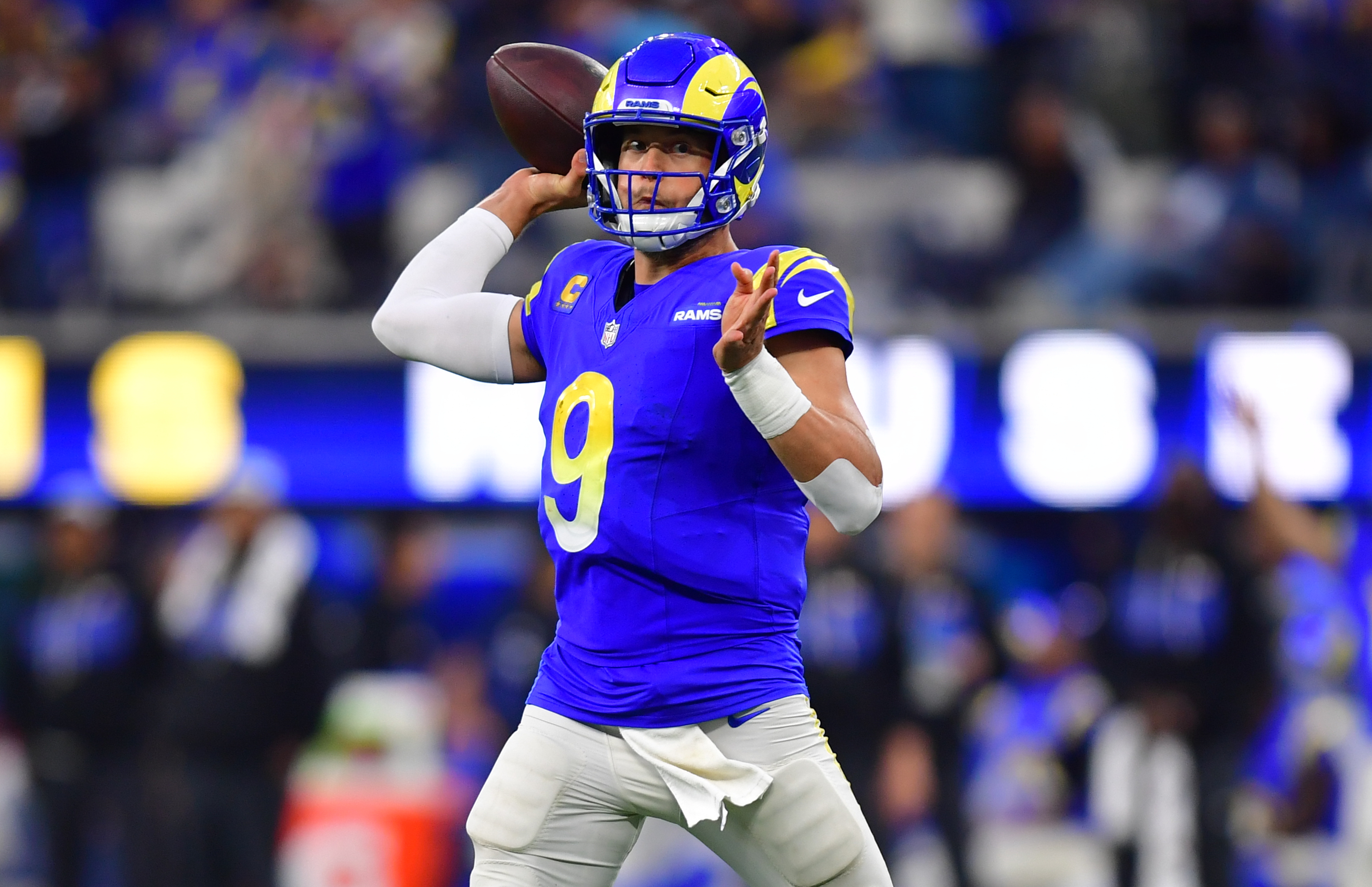Los Angeles Rams quarterback Matthew Stafford (9) throws a pass as we offer our NFL AI predictions for Week 17.