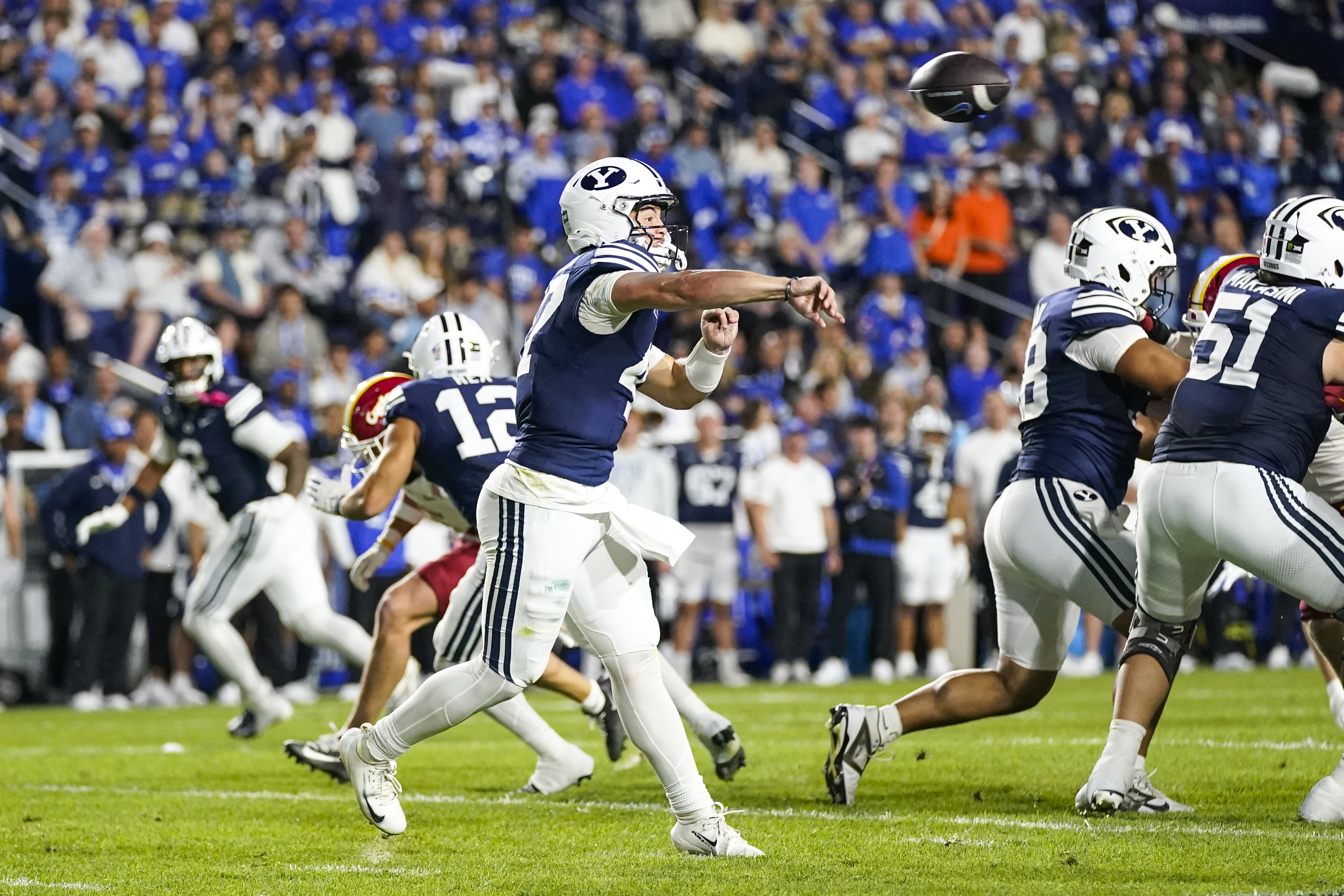 Pictured: Cougars QB Bear Bachmeier throwing a pass as we break down our Notre Dame vs. BYU Prediction. Photo by Aaron Baker-Imagn Images.