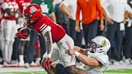 Jax State's Cam Cook tries to evade the tackle as we look at our college football player props and anytime touchdown scorer predictions