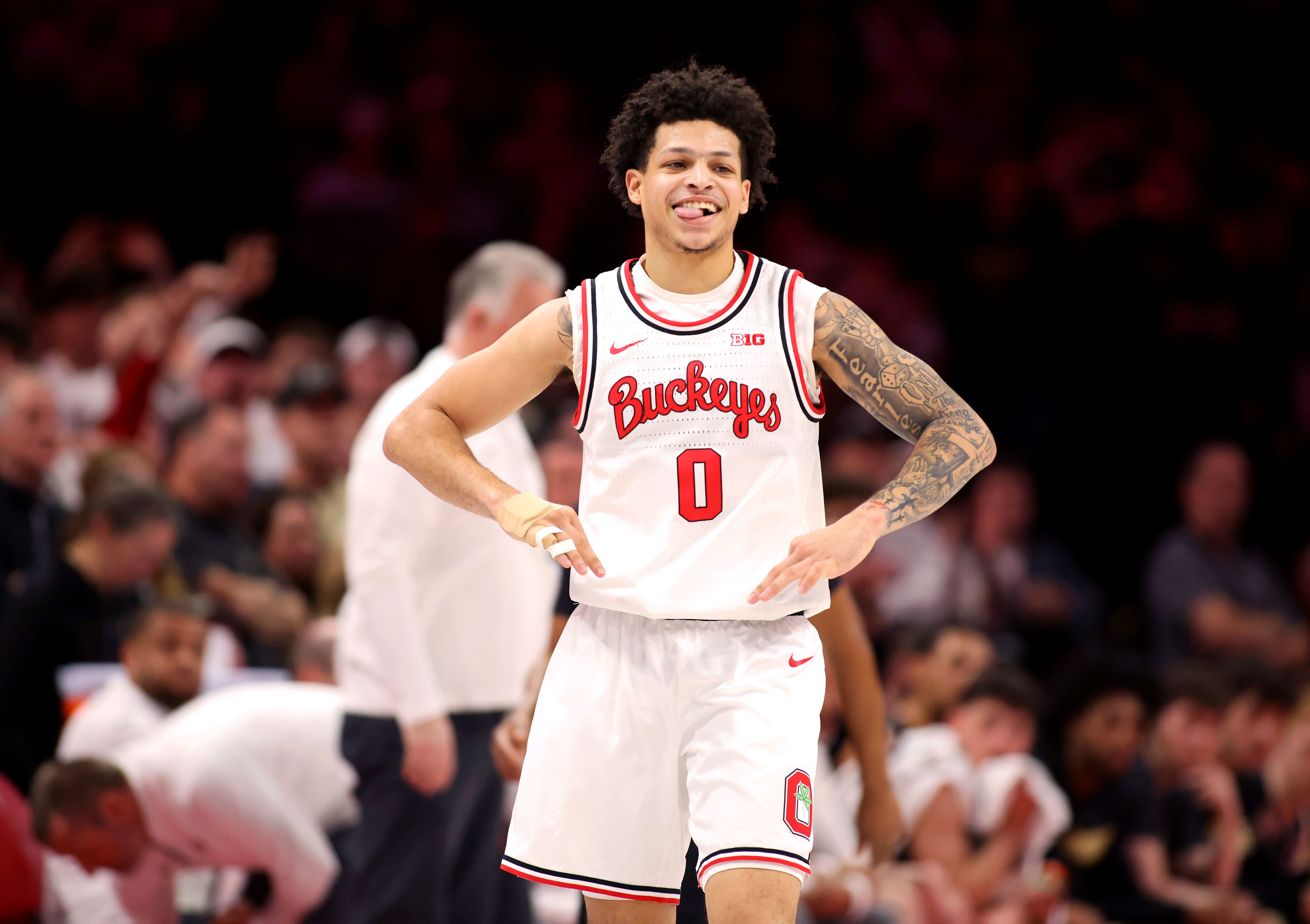 Ohio State Buckeyes guard John Mobley Jr. celebrates as we offer our best Ohio State vs. Penn State predictions