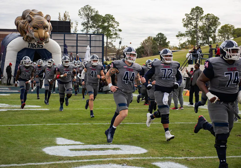Jackson State Tigers players run onto the field before the SWAC Championship game against the Southern Jaguars, and we offer our top Jackson State vs. South Carolina State early picks.