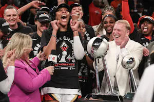 Las Vegas Aces forward A'ja Wilson (22) and owner Mark Davis celebrate after winning the 2023 WNBA Finals, as we examine the latest 2024 WNBA championship odds with the Las Vegas Aces as the favorites.