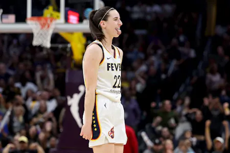 Caitlin Clark (22) of the Indiana Fever reacts as we offer our best Fever vs. Aces prediction and expert picks for Saturday's WNBA game at Michelob ULTRA Arena in Las Vegas.