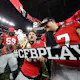 Stetson Bennett of the Georgia Bulldogs celebrates with Payne Walker of the Georgia Bulldogs and Broderick Jones of the Georgia Bulldogs after beating the TCU Horned Frogs in the College Football Playoff National Championship game at SoFi Stadium.