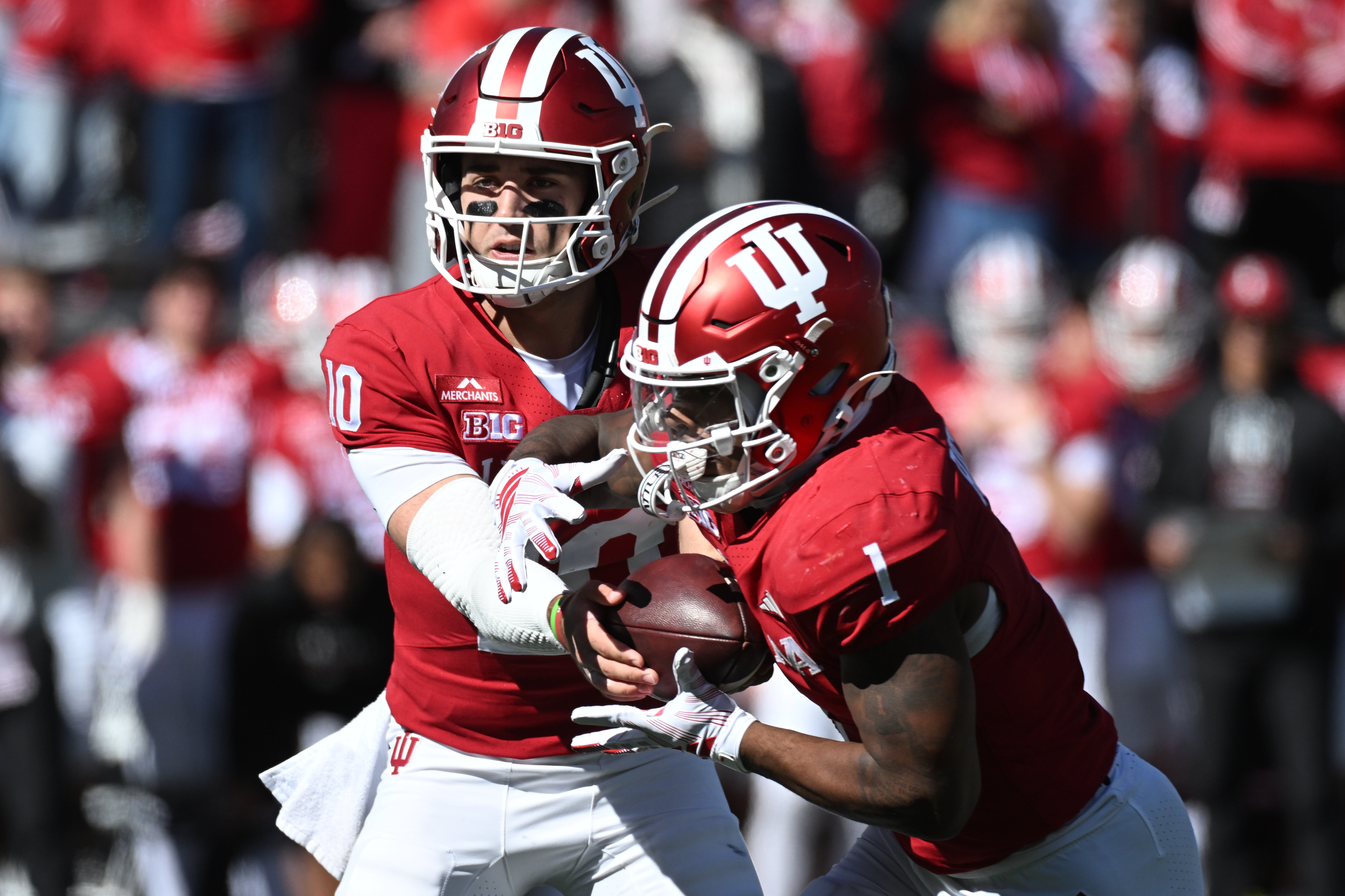 Indiana Hoosiers quarterback Josh Hoover (10) hands off to running back Turbo Richard (1) as he is featured in our college football anytime touchdown scorer predictions Week 8.