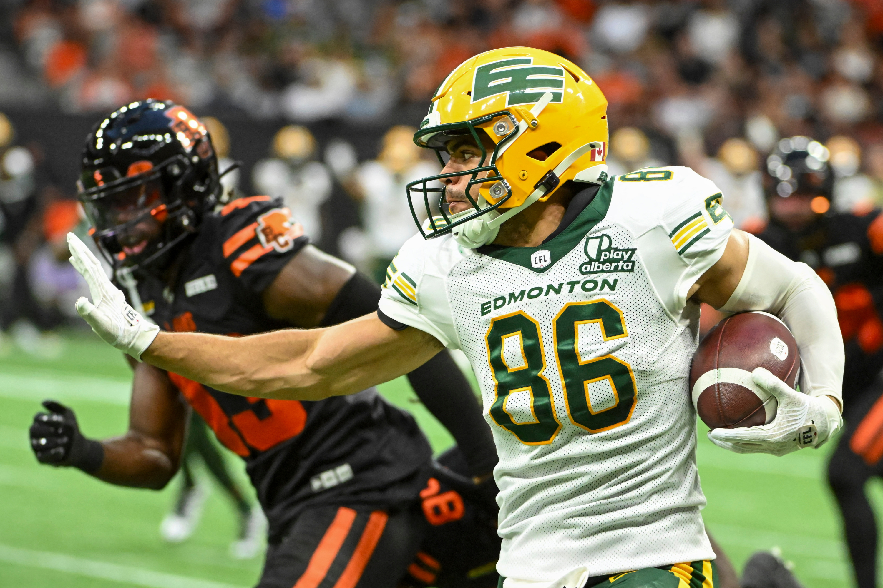 Edmonton Elks running back Justin Rankin (5) is tackled as we break down our Elks vs. Alouettes prediction.