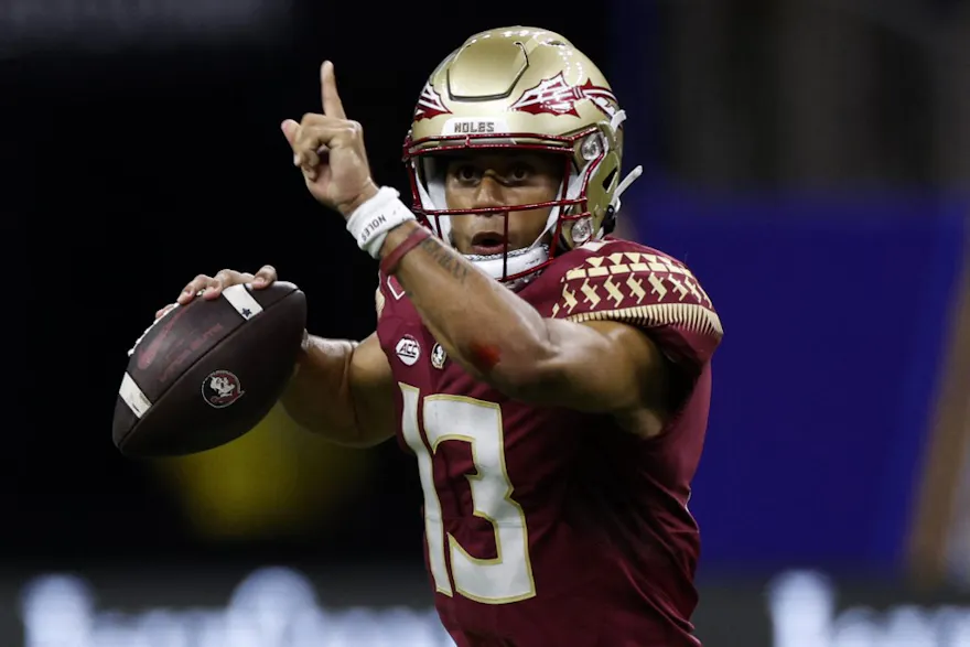 Quarterback Jordan Travis of the Florida State Seminoles throws a pass against the LSU Tigers at Caesars Superdome.