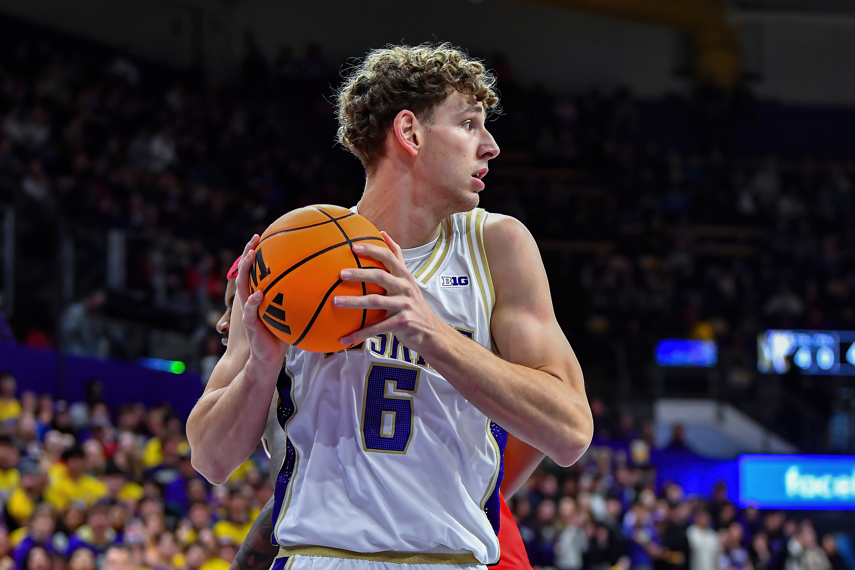 Washington forward Hannes Steinbach (6) looks to pass as we offer our college basketball predictions and best bets today.