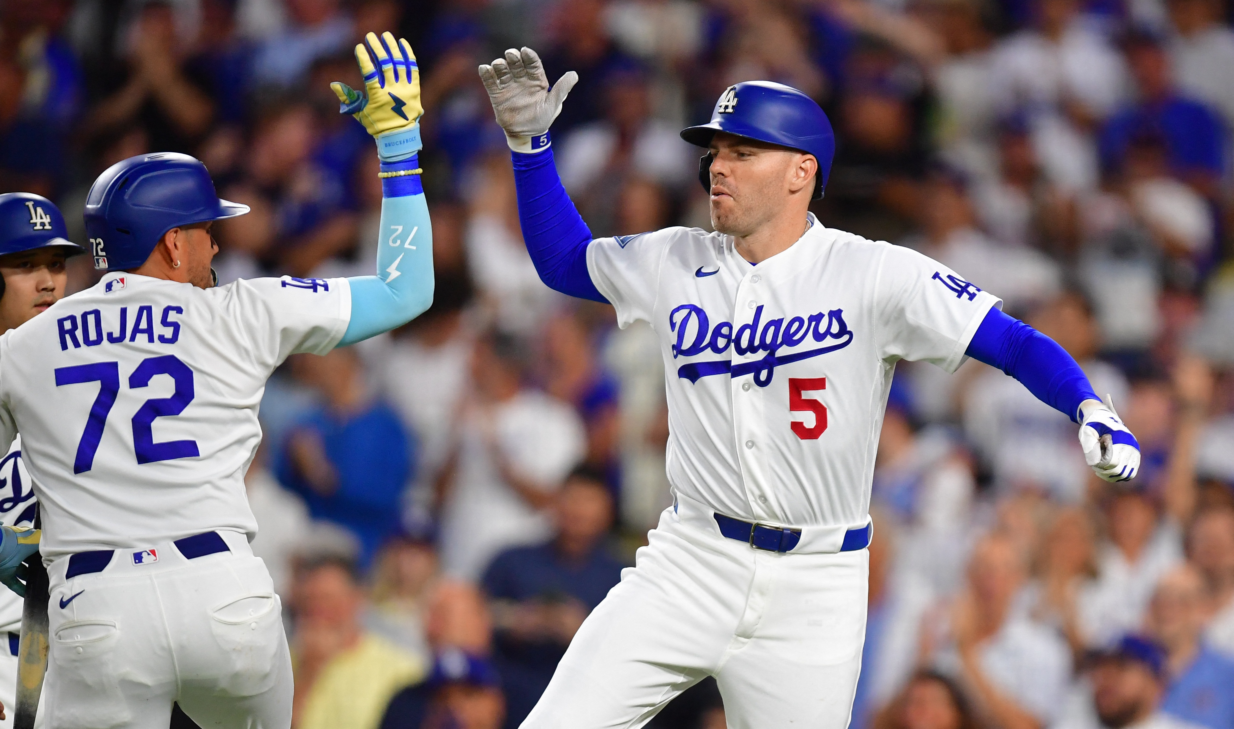 Los Angeles Dodgers Freddie Freeman celebrates as we make our best Padres vs. Dodgers prediction.