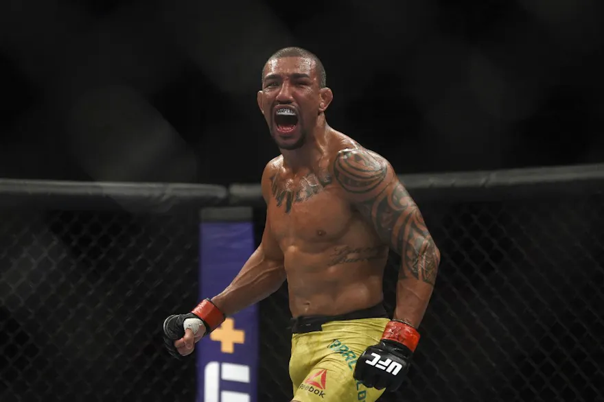 Brazilian fighter Raoni Barcelos celebrates after wining the fight against Peruvian fighter Carlos Huachin during their men's bantamweight bout at UFC 237.