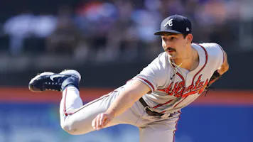Spencer Strider #65 of the Atlanta Braves pitches in the second inning against the New York Mets at Citi Field on Aug. 7, as we look at the 2024 MLB strikeout leader odds.
