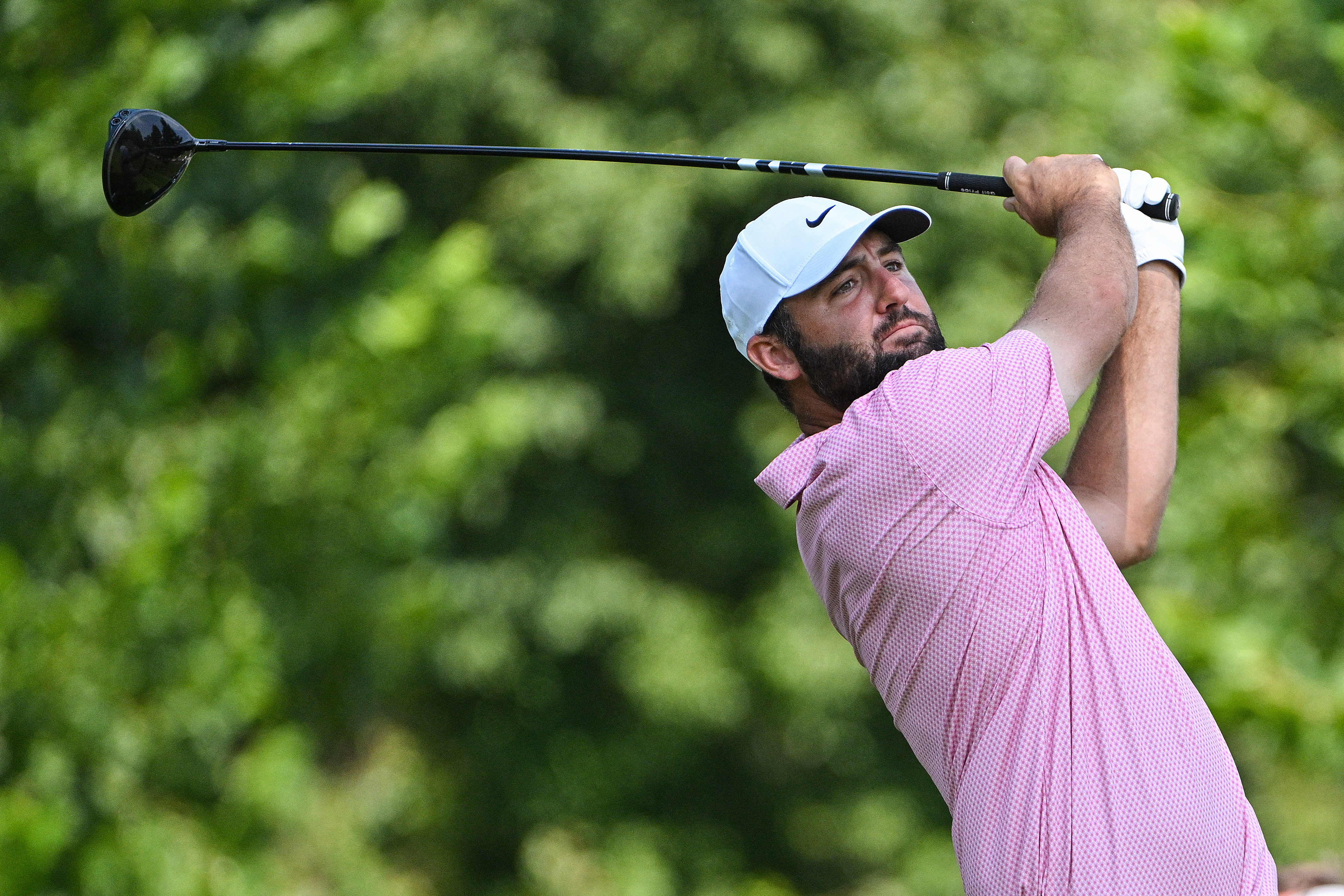 Scottie Scheffler plays his shot on the eighth tee as he is featured in our TOUR Championship Picks & Predictions.