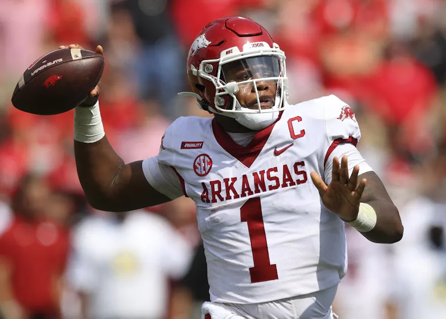 KJ Jefferson of the Arkansas Razorbacks rolls out to pass in the first half against the Georgia Bulldogs at Sanford Stadium.